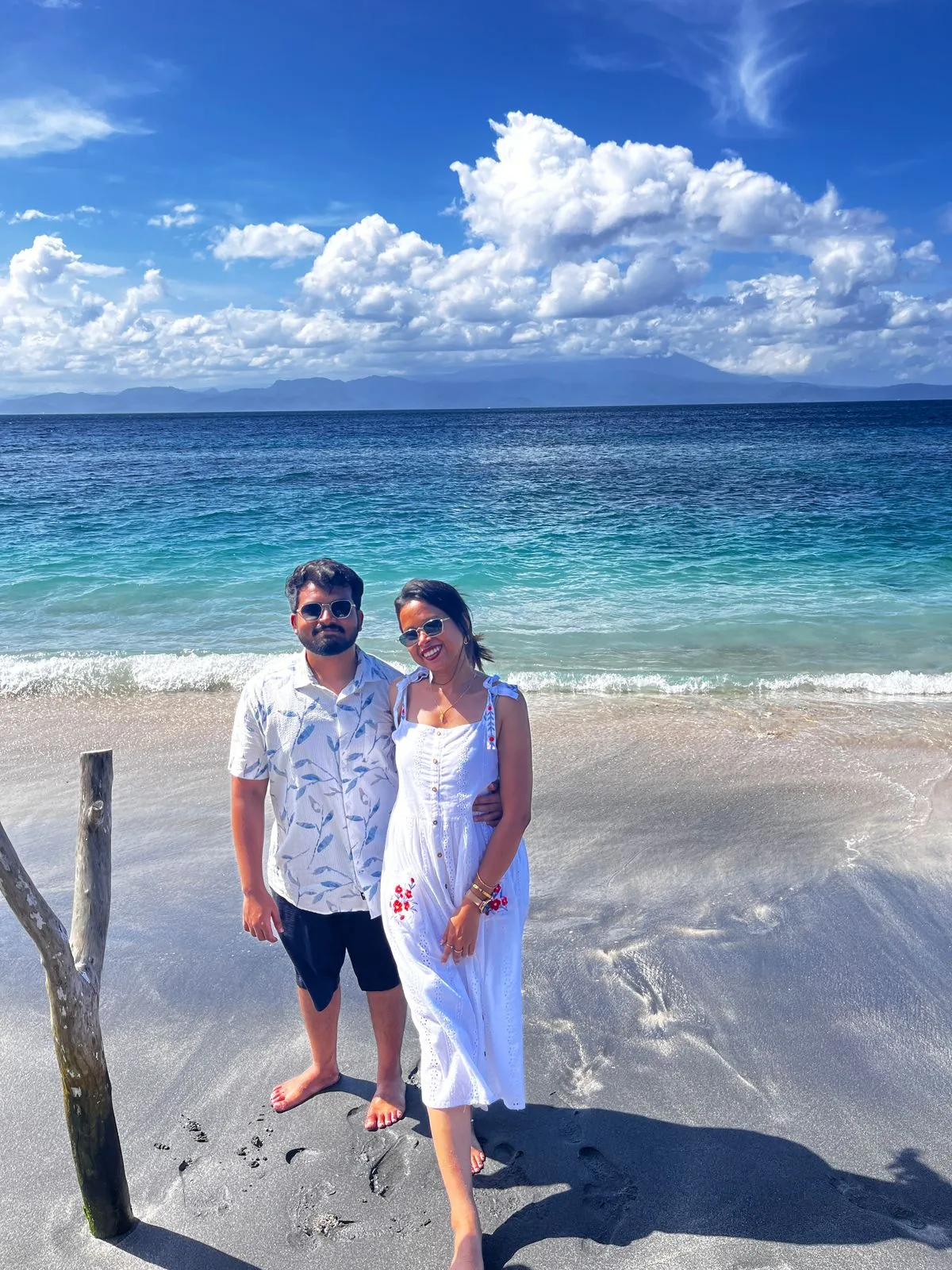 Tripaway travellers standing together beside a tropical sea