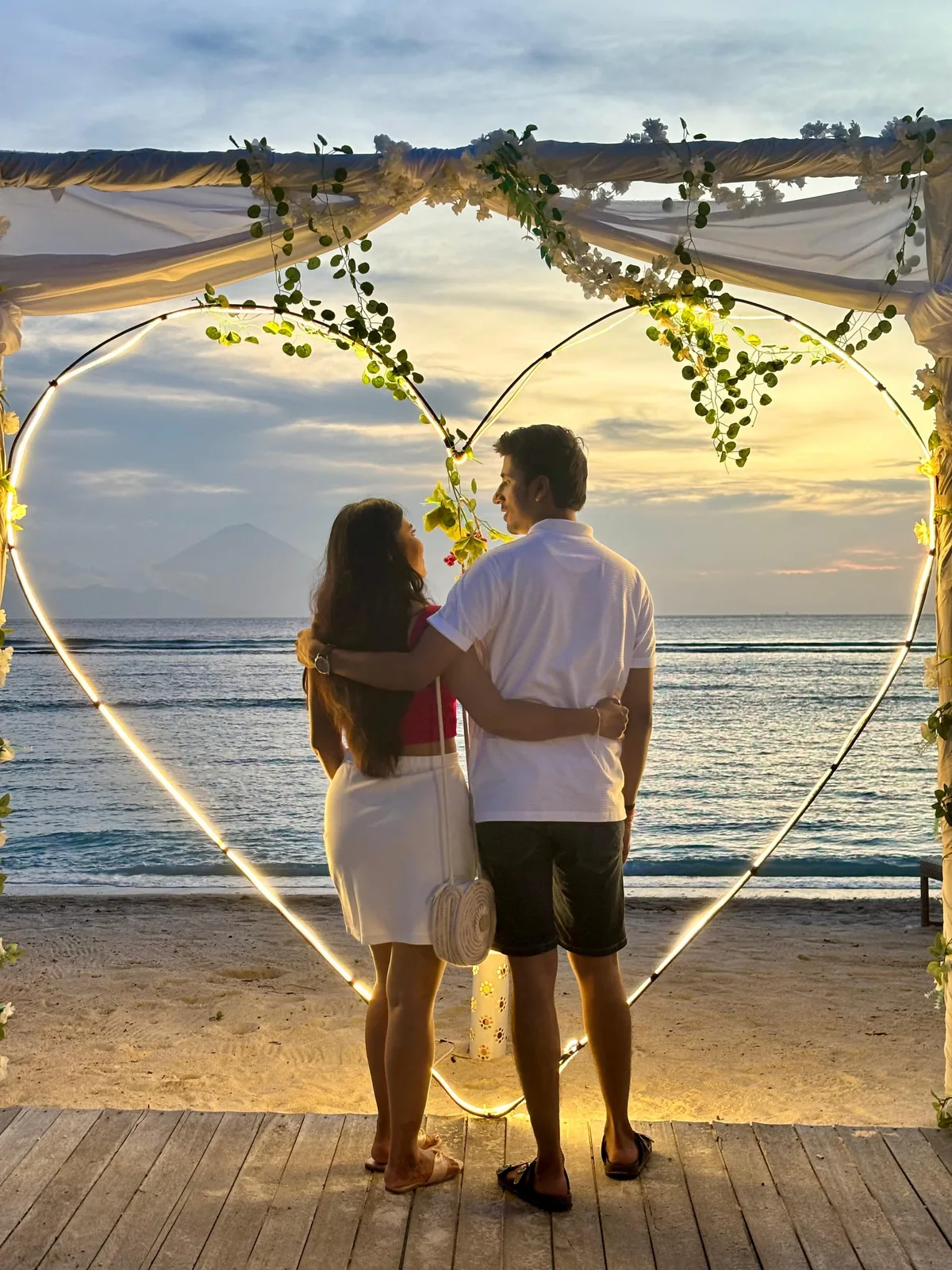 A Tripaway couple at a heart-shaped beach installation